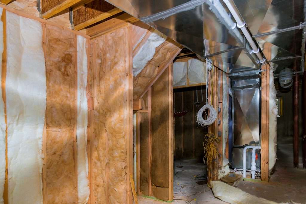 Thermal insulation with house construction site basement walls of new house under construction